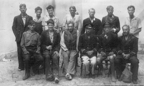 The British Survivors: Standing (L to R): W. Carney, J. Wheater, R. McKinnon, D. Purdie, E.G. Westgarth, L.G. Soan, T.H. Blank Seated (L to R): D. Hawcroft, W. Malcolm, W. MacVicar, F.L. West, LS. McIntosh, W.F. Davies.
