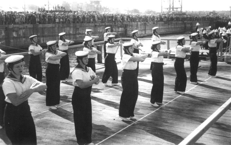 WRANS Performing a sea shanty during a Garden Island open day, circa 1950s. RAN image.