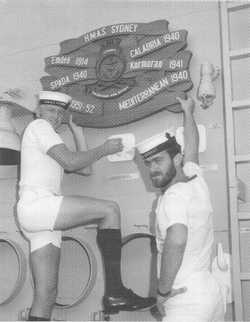 Sailors of Sydney (IV) pose before her impressive legacy of battle honours (Image:RAN)