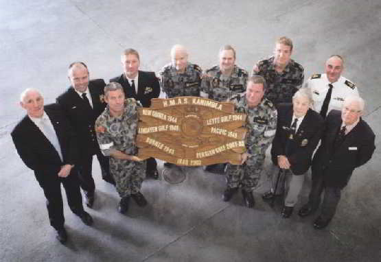 Former Commanding Officer of HMAS Kanimbla (II) in 2001-2003 (Capt David McCourt, OAM, DSM, RANR - Far left) and Mr Keith Bray and Mr Don Sykes from HMAS Kanimbla (I) join with Cmdr Tim Byles (Current CO of Kanimbla - second from left) for the HMAS Kanimbla Battle Honour Board Re-Dedication Ceremony. Joining them were members of Kanimbla's current crew who also served onboard on 2001-2003. Kanimbla was recently was recently awarded new honours for Borneo 1945, Persian Gulf 2001-2003, and Iraq 2003. 