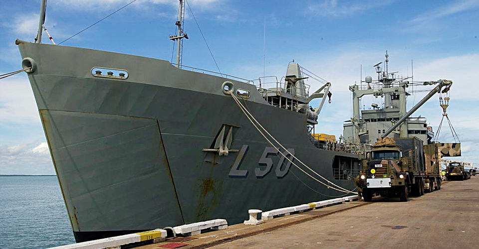 HMAS Tobruk, loading equipment for the Australian Army’s 1st Brigade