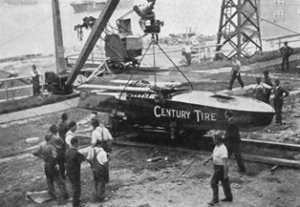 Built by the Aircraft Department, the hydroplane Century Tire about to be lowered over the cliff on the way to the water