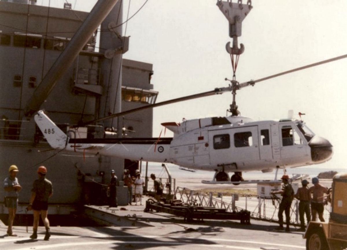 Unloading a RAAF Iroquois helicopter, from HMAS Tobruk, at Ashdod, Israel March 1982. (RAN)