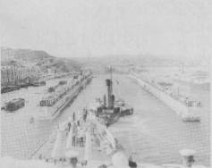 During her first run to the Mediterranean AUSTRALIA was docked in the large Admiralty Floating Dock in Malta. She is seen here entering the flooded down dock. June 1935.