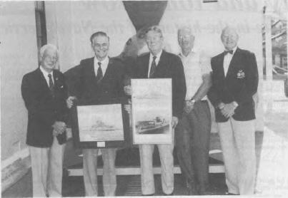 Mr Birrell, Mr Lind, Captain L.M. Hinchliffe, Mr Date, Mr Des Hagan accepting the memorabilia from the the HMAS Canberra/Shropshire Association of N.S.W