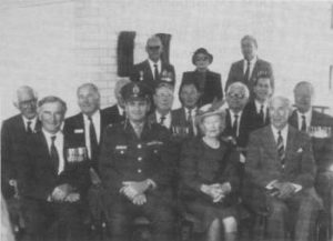 From Left to Right: Vice Admiral Sir Richard Peek, K.B.E., C.B., D.S.C., Admiral Sir Anthony Synnot, K.B.E., A.O., Mr Roy Scrivener, O.A.M., Secretary H.M.A.S. Hobart Assoc., Rear Admiral W. D. H. Graham, C.B.E., Major General Peter Day, A.O., Commandant A.D.F.A., Captain L. M. Hinchliffe, D.S.C., Pres. Naval Historical Society, Mr David Hopkins, Secretary H.M.A.S. Australia Veterans Assoc., Mrs J. R. Farncomb, O.B.E., Rear Admiral W. J. Dovers, C.B.E., D.S.C., Commodore Peter Dechaineux, A.M., Admiral Sir Victor Smith, A.C., K.B.E., C.B., D.S.C., Commodore Ian Burnside, O.B.E. Standing: Mr Jack Willis, President, Naval Assoc. A.C.T., Mrs Willis, Mr John Allerton, H.M.A.S. Arunta Assoc. (Photo taken on 29/9/1989 at the A.D.F.A. by Alan Zammit)