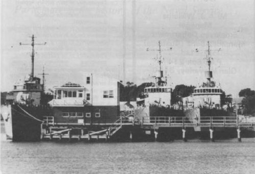 Rockingham Naval Jetty, Cockburn Sound, W.A. - 23/05/1955 (L-R): HORSHAM (being dismantled), PARKES (being dismantled), KATOOMBA (being dismantled) prior to being towed to Hong Kong for scrapping (Photo:WA Newspapers Ltd).