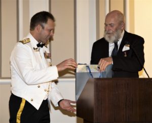 CN receives a book from Wes Olsen he wrote on HMAS Sydney II