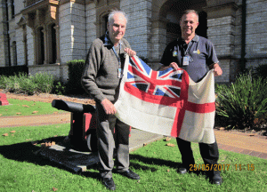 Norm Rivett hands Ensign to Commander Peter Cole 25 May 2017