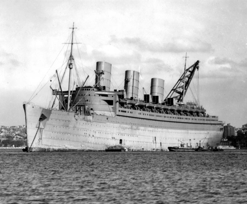 Queen Mary at anchor in Sydney Harbour in 1940 during her conversion to a troopship