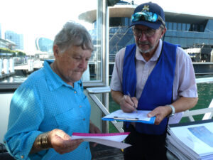 Ray Rees checking in guests
