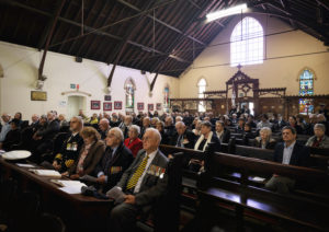 Naval personnel gather with churchgoers for the Australian White Ensign replacement ceremony during a Sunday service at the St John's church, Birchgrove, New South Wales.service at the St John's church, Birchgrove, New South Wales.